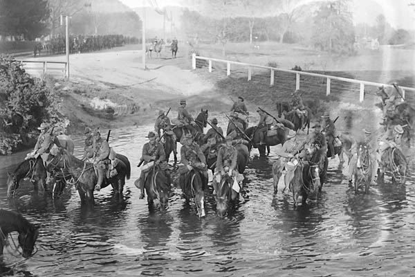 The Canterbury Mounted Regiment on its march to the troopships watering horses in the River Avon, Near Carlton Bridge, Christchurch.